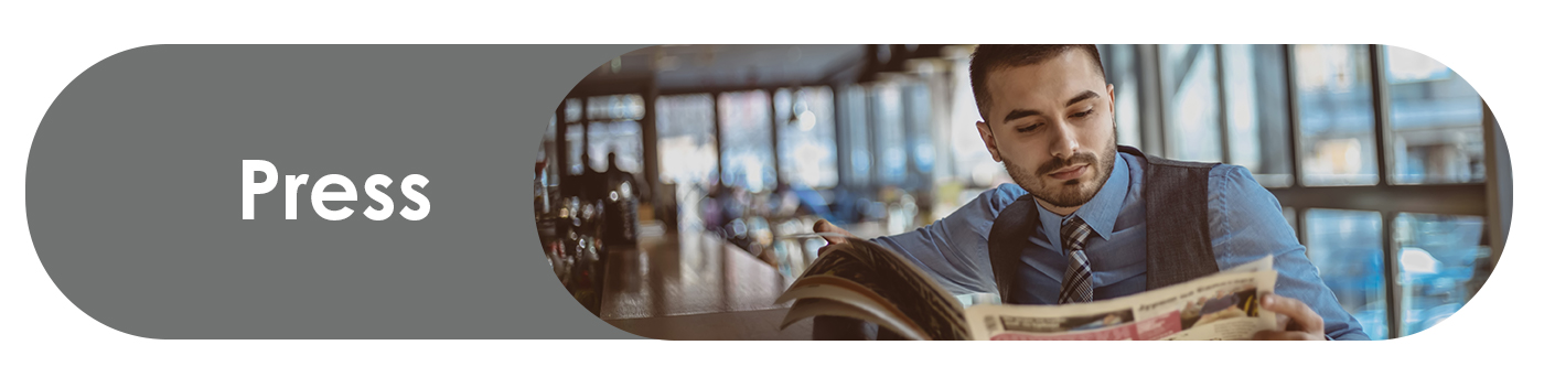 Mortgage account executive reads newspaper and press in cafeteria